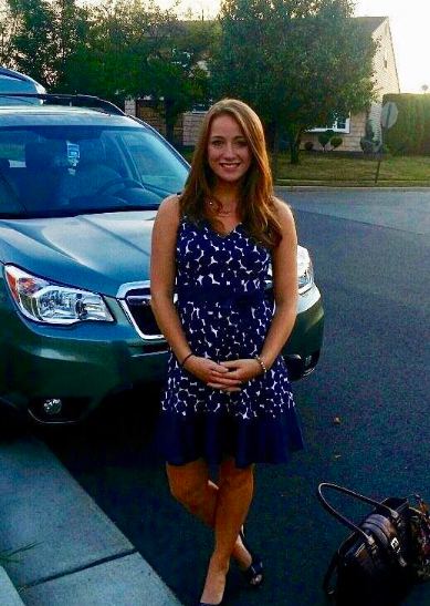 Kelly Ann Cicalese posing with her car