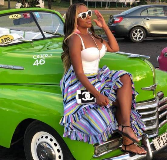 Kijafa Vick posing with her car
