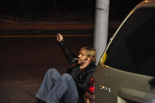 Ron Eldard posing for the photo with the car