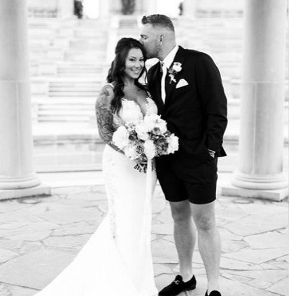 Samantha Ludy with her husband, Pat McAfee on their wedding day