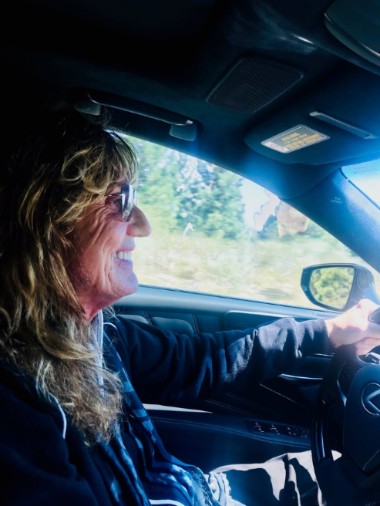 Tawny Kitaen's ex-husband, David Coverdale riding a car
