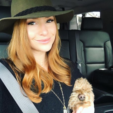 Walker Forehand's wife, Kristin Fisher posing inside her car