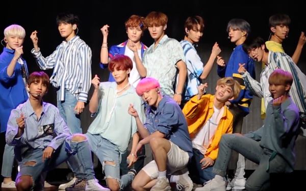 Yoon Jeonghan with his band members
