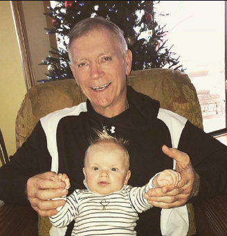 Robert Luke Yunaska posing for the photo with his grandson