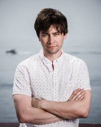 Torrance Coombs posing for the photo