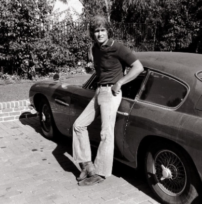  Late Michael Landon posing for a photo with his car 