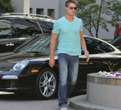 Justin Hartley outside his car