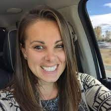 Tiffany Heinen posing for the photo inside the car