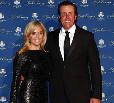 Evan Samuel Mickelson's father and the mother posing for the photo
