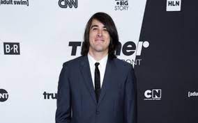 J. G. Quintel posing for the photo