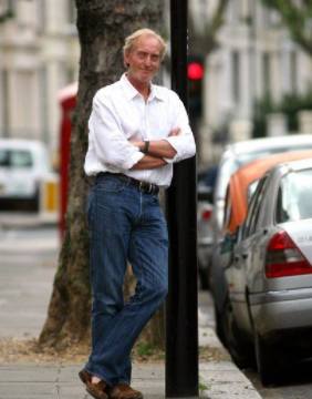  Charles Dance posing for a photo
