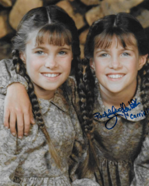 Lindsay Greenbush posing for a photo with her twin sister