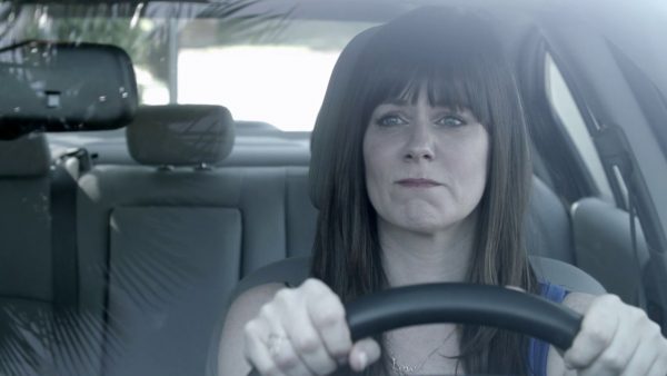 Katie Featherston driving the car