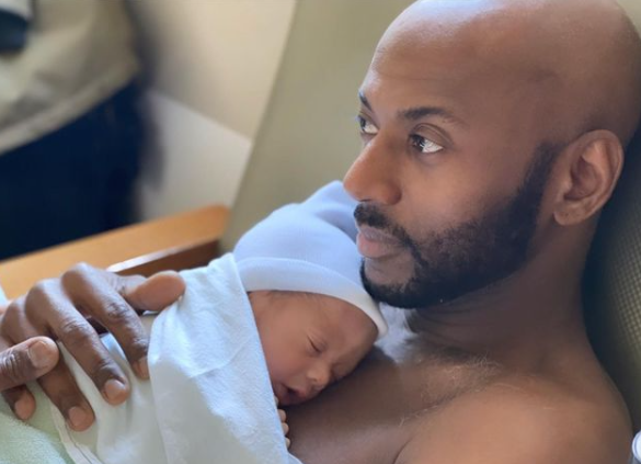 Romany Malco with his child
