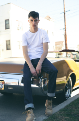 Jacob Bixenman posing for a photo with car