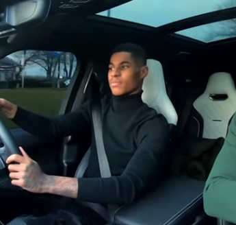 Marcus Rashford driving the car