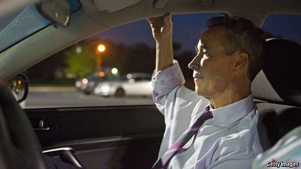 Joe Morrissey sitting inside the car