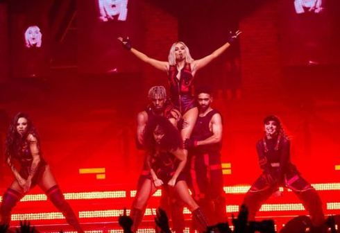 Perrie Edwards performing on the stage