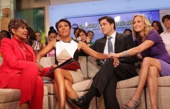 Amber Laign's partner, Robin Roberts with her co-workers