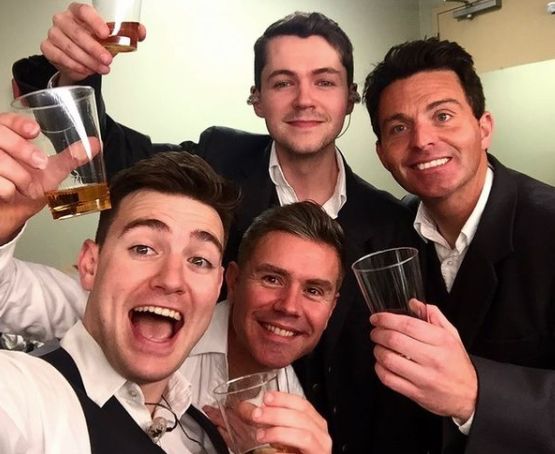 Emmet Cahill with Celtic Thunder's group members