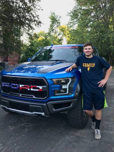 Emumita Bonita's husband, Nickmercs posing with his car