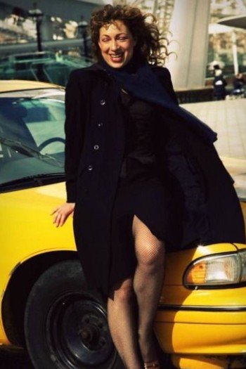 Florian Haertel's ex-wife, Alex Kingston posing with her car