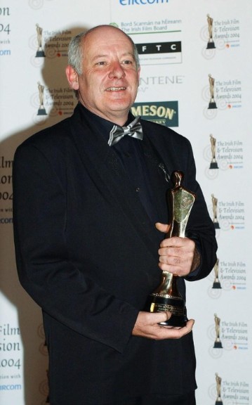 Gerard McSorley posing with award