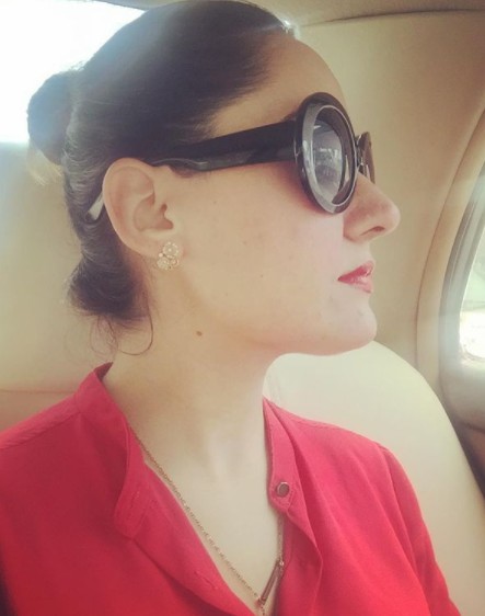 Gharida Farooqi posing inside her car