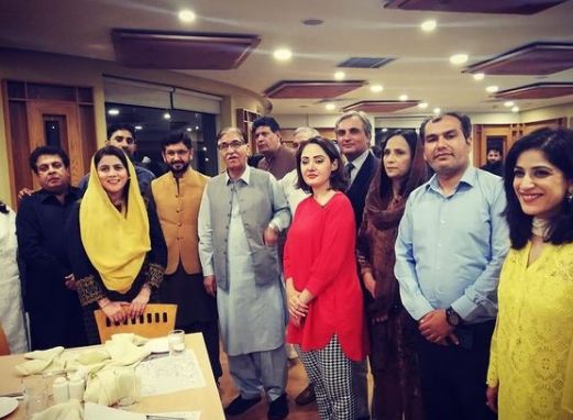 Gharida Farooqi with her co-workers