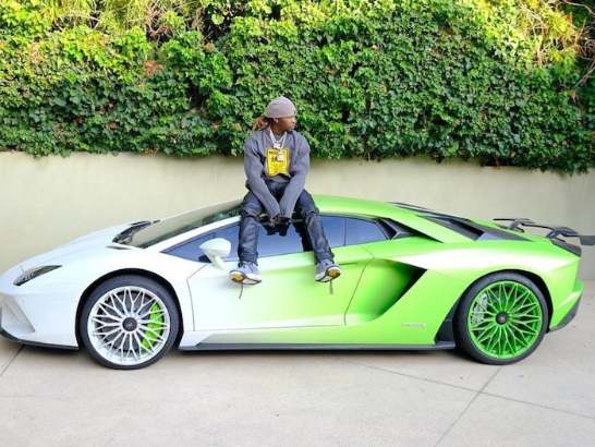 Kody Cephus's father, Offset posing with his car