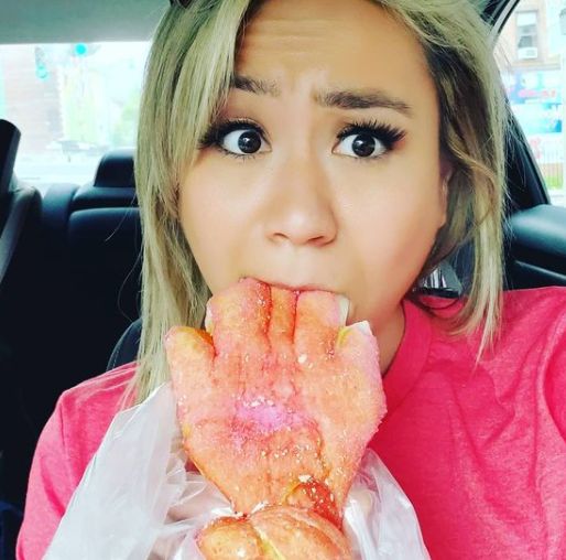 Miki Sudo eating inside her car