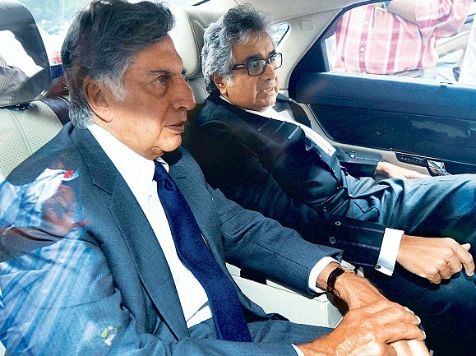 Sakshi Salve's father, Harish Salve and his co-worker posing inside his car