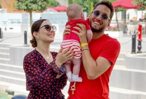 Sinem Gundogdu and her husband, Hakan Çalhanoğlu with their child