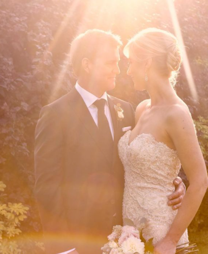 Anne Drewa posing for a photo with her boyfriend
