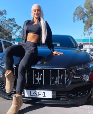  Lauren Simpson posing for a photo with car 