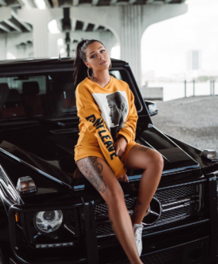 Valerie Cossette posing for a photo with car