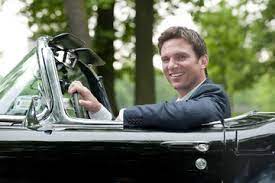 Bill Weir inside the car