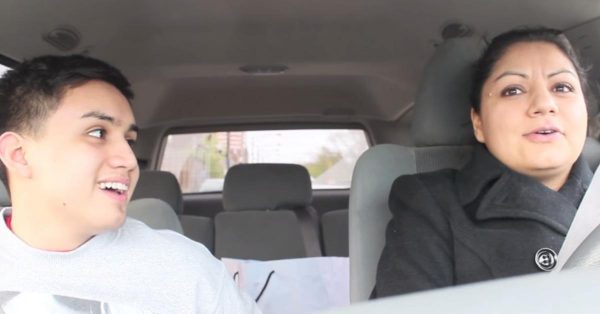 Sergio Razta sitting inside the car with his sister