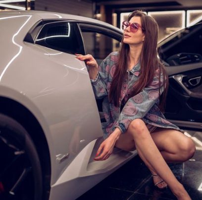 Giorgia Andriani posing with her car