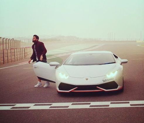 Gurikk Maan posing with his car