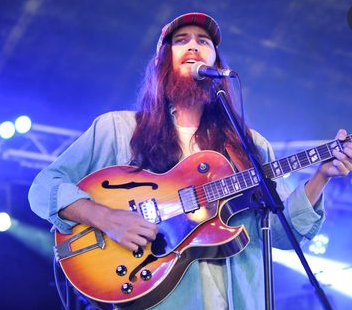 Danny Fujikawa singing on the stage