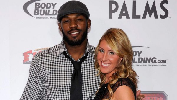 Jon Jones posing for a photo with his wife Jessie Moses