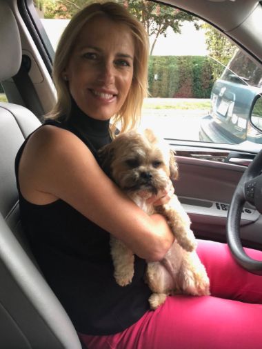 Laura Ingraham posing inside a car