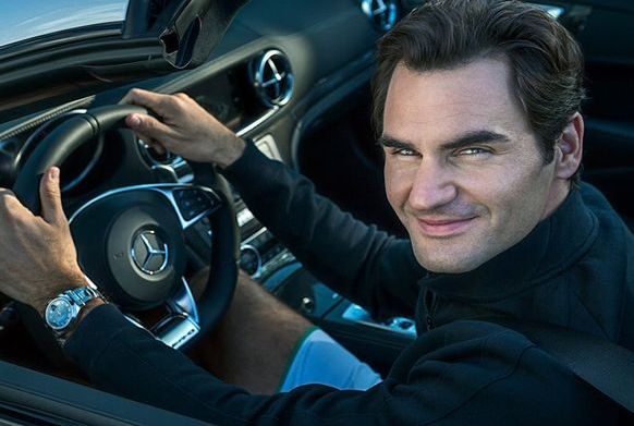 Mirka Federer's husband, Roger Federer posing while driving a car
