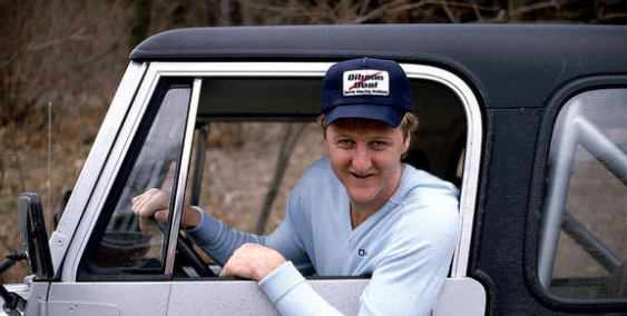 Larry Bird sitting inside the car