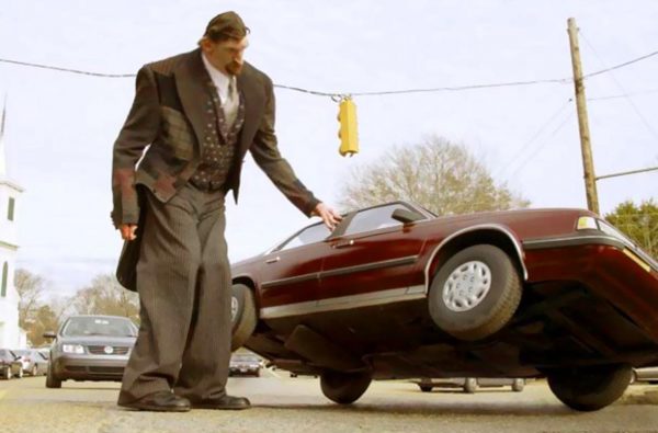 Matthew McGrory standing outside the car