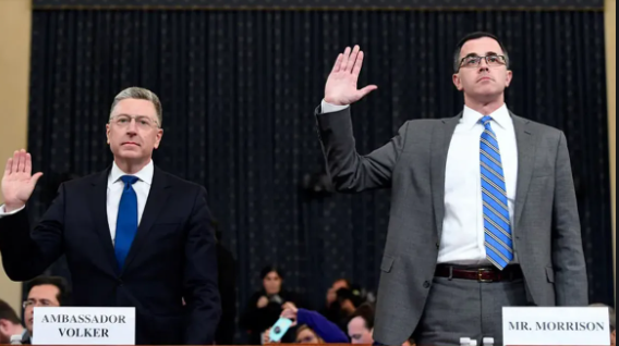 Tim Morrison in the office with his partner