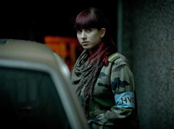 Harriet Cains standing outside the car