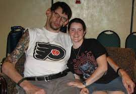 Matthew McGrory posing for a photo with his girlfriend Melissa Davis