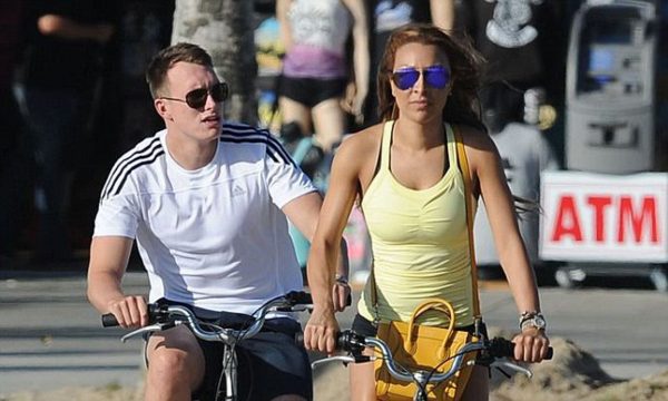Kaya Hall and her husband Philip Anthony Jones riding the cycle